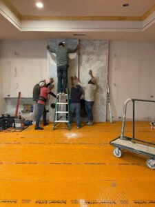 Professional crew working on an interior remodel while homeowners hire a Luxury Home Renovation Contractor in Far North Dallas for high-end home upgrades.