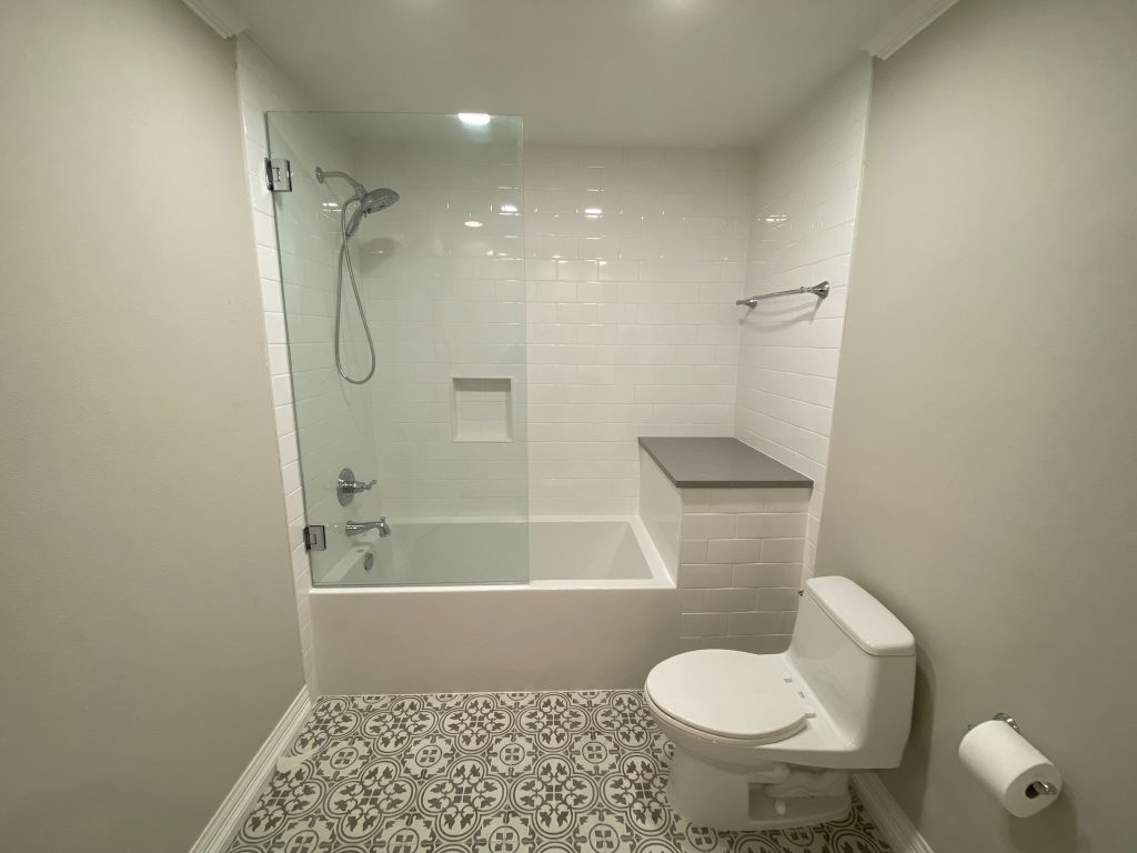 Modern bathroom with shower and toilet and Carrollton Bathroom Contractors