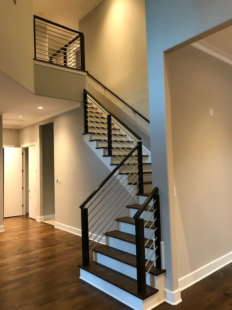A beautifully modern remodeled staircase in Dallas home.